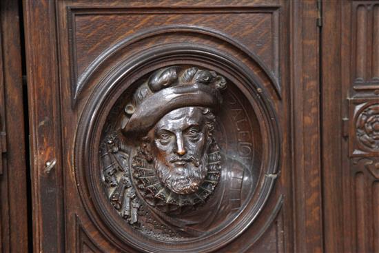 A late 19th century large carved oak breakfront sideboard, W.7ft 9in.
